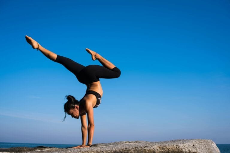 Woman in yoga pose on a sunny day